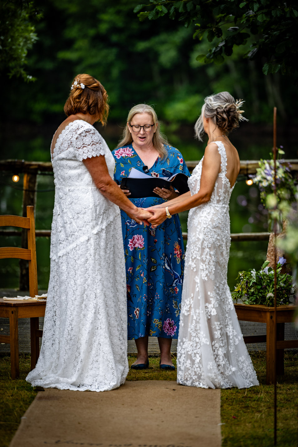 Deb Reed Celebrant Colchester Essex, officiating at the wedding of Cheyney and Albert during their first kiss.